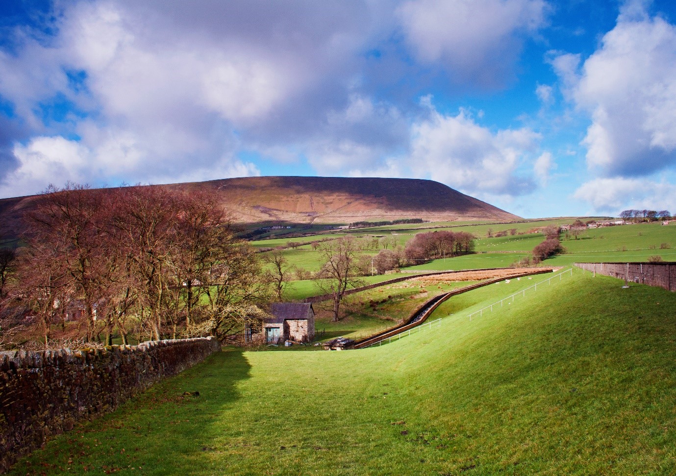 view of pendle hill located in the lancashire countryside