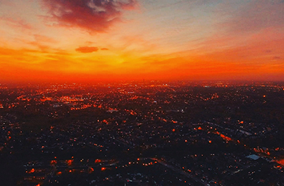 a image of a city frm birds-eye-view taken at sunset