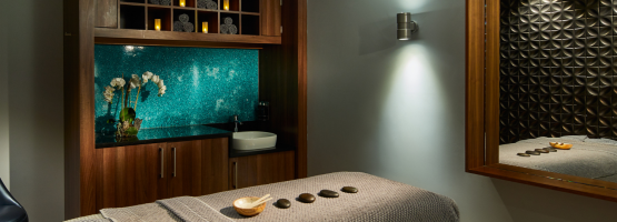 rejuvenating spa treatment area with ambient lighting and a trea