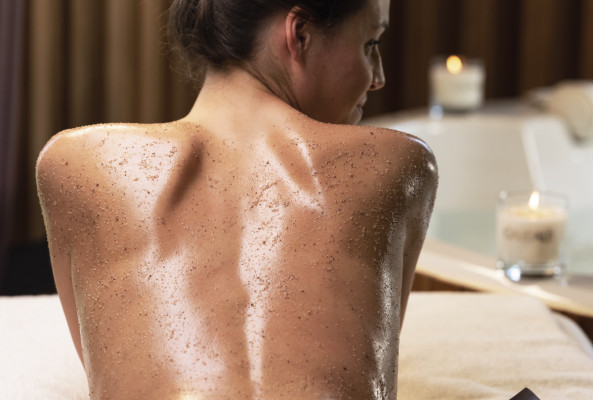 female client at the midland rena spa with body scrub on her bac