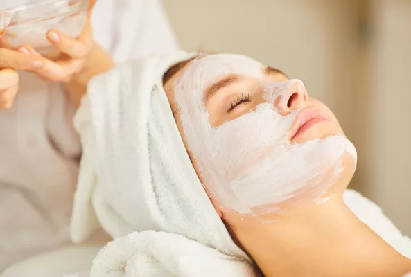 female client at The Midland Rena Spa receiving a facial  