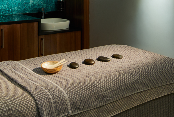 treatment bed with stones arranged on it at the rena spa at the